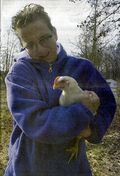 [Picture of Pattrice Holding a Chicken]