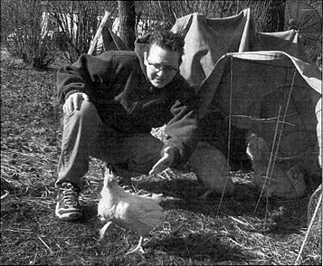 [Picture of Pattrice releasing a chicken]