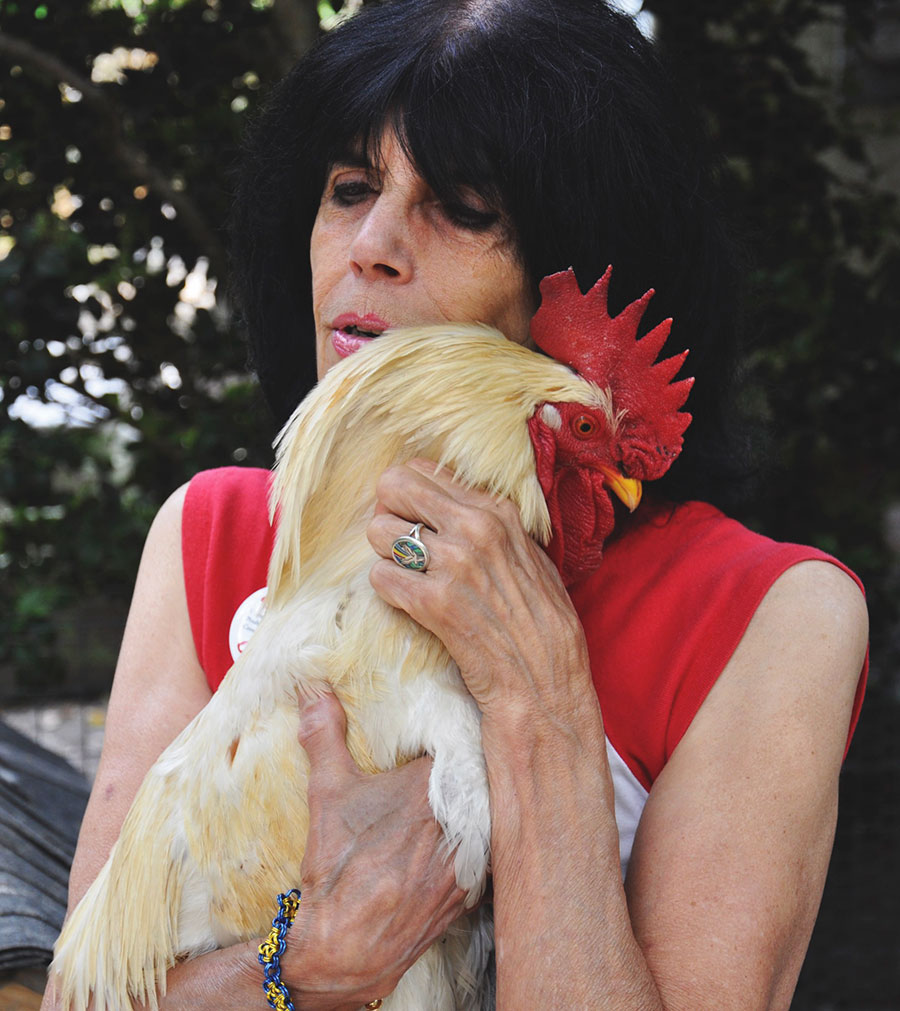 Karen holding Nathaniel the rooster