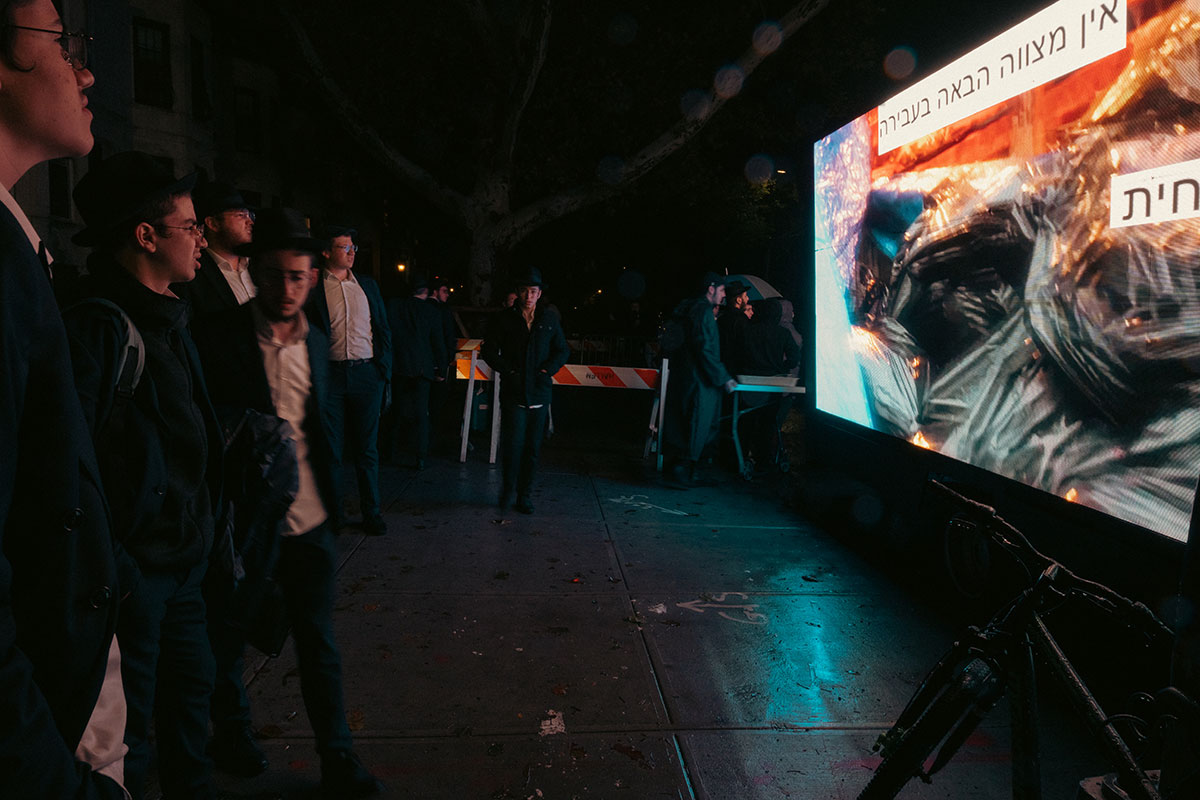 Kaporos Participants Watch Giant Video on Truck